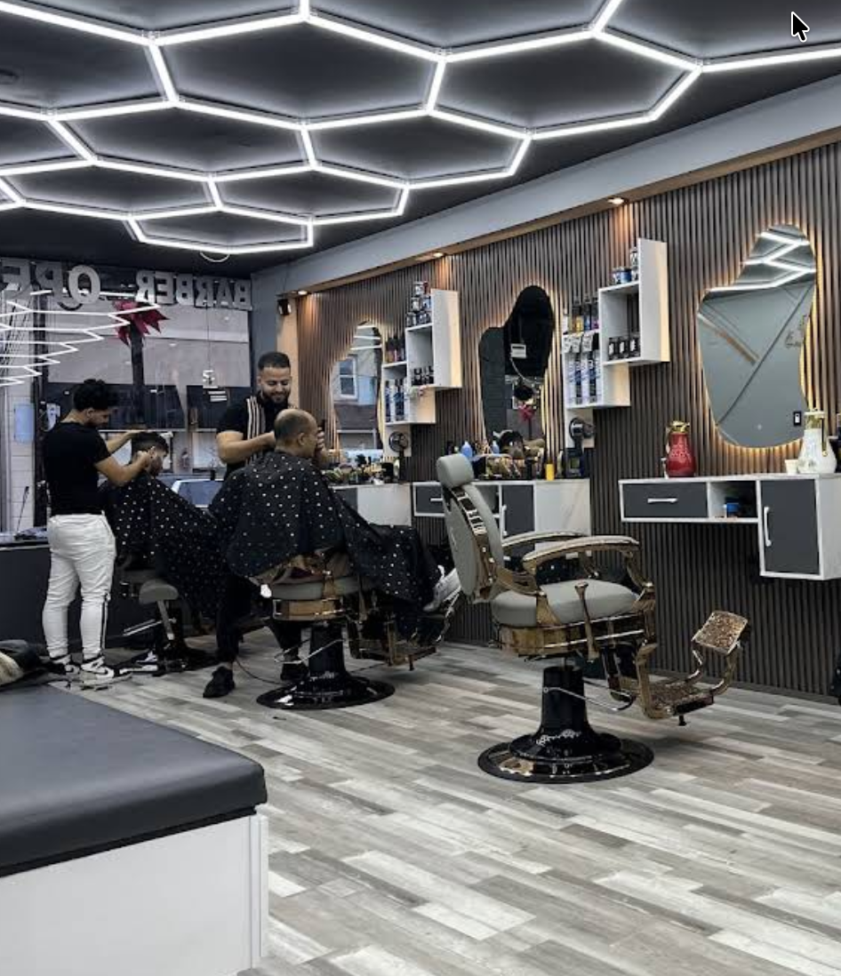 Inside Sully Cutz under the signature hexagon lights